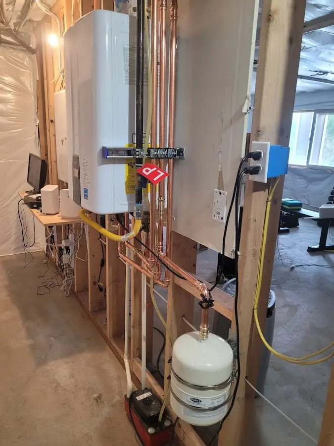 Licensed plumber repairing a kitchen sink in Highland