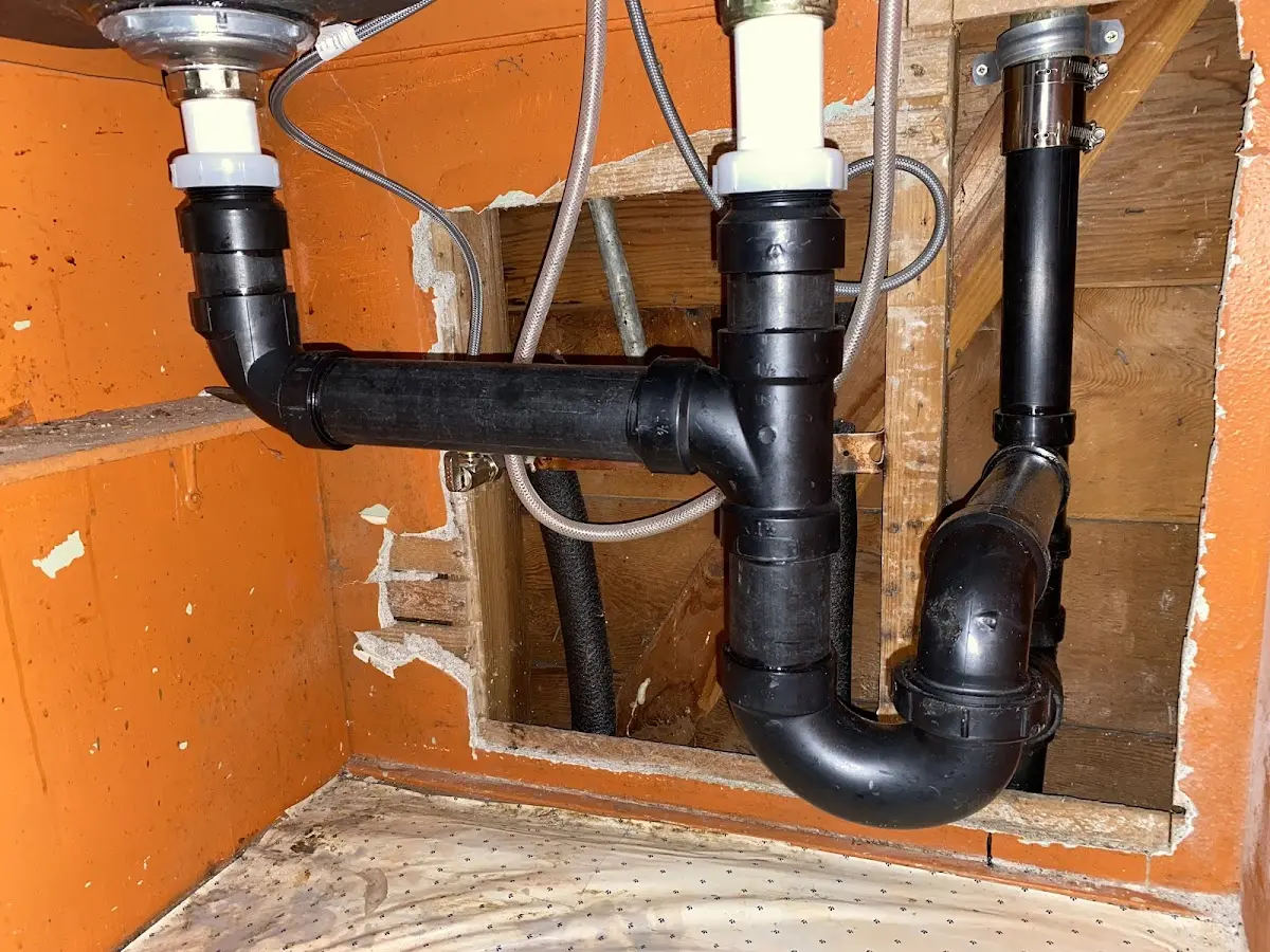 Professional Garbage Disposal Repair equipment and tools on the job in Highland